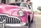 Pink Vintage Antique Car. Buick Super Convertible Sedan Parked Aside the Road in an Old Neighborhood of Patras