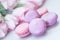 Pink and violet Macarons, spring flowers, tulips, tender pastel background. Romantic morning, gift, present for beloved