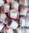 Pink and violet marshmallows at restaurant candy bar