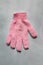 Pink washcloth glove for home peeling and skincare, hygiene and body care concept