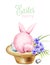 Pink watercolor fluffy easter bunny sitting on a hat with lily flowers and colorful eggs