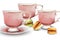 Pink watercolor tea cups with macaroon sweets
