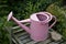 Pink watering can