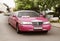 Pink wedding limousine