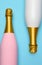 A Pink and a White Champagne bottle on a blue teal background. Vertical Hig angle shot