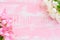 Pink and white Flowers on a pastel bright pink wooden background
