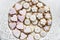 Pink and white glazed cookie biscuits on tray