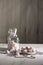 pink and white meringue candies in a vase and on a saucer, sweet still life,