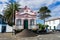 Pink and white shrine with a cross on top in Terceira Island S. Portugal