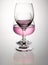 Pink wine in brandy glass overlap and reflection