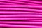 Pink wire, the coil of plastic in the macro