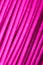Pink wire, the coil of plastic in the macro
