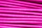 Pink wire, the coil of plastic in the macro