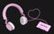 Pink wireless headphones link cassette tapes , 3d rendering