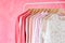 Pink women clothes hanging on rack