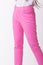 Pink women trousers in white background.