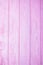 Pink wooden texture background. Wooden surface. Vertical photo