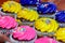 Pink, yellow and purple cupcakes ready for the party.