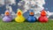 Pink yellow red and blue ducks