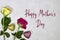 pink and yellow roses flowers and glitters hearts with happy mother\\\'s day on gray background