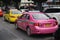 Pink and yellow taxis in Bangkok, Thailand