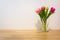 Pink Yellow Tulips Wooden Table White Wall Glass Vase