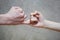 Pinky swear handshake of teenage brother and sister