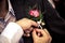 Pinning a boutonniere