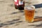 Pint glass of amber Pale Ale beer on a old wood table