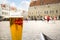 A pint glass of the Estonian beer A le Coq at an outdoor cafe in the historic Old Town square of Tallinn Estonia