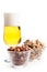 Pint of lager and peanuts on white background