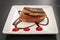 Pintxos or tapas of foie gras on a plate in a restaurant in Pamplona, Spain