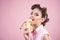 Pinup girl with fashion hair. pin up woman with trendy makeup. banana dieting. retro woman eating banana. pretty girl in