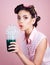 Pinup girl with fashion hair. pin up woman with trendy makeup. perfect housewife. retro woman drink summer cocktail
