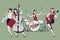 PinUp Girls Band. Four beautiful and tattooed pinup girls playing music. Vector Illustration