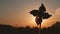 Pinwheel windmill against a sun. Windmill silhouette.