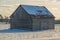 Pioneer log cabin barn in Eastern ontario in winter
