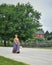 Pioneer Woman Walking Down Street Carrying Basket