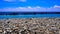 Pioppi beach, Cilento, Campania, Italy. Pebbles, blue sea and blue sky
