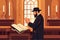 Pious jew prays in synagogue, reading torah, vector illustration, religion