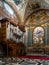 Pipe organ in old Basilica St Mary of Angels and Martyrs built inside Baths of Diocletian in Rome, Italy