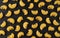 Pipe rigate pasta pattern on black background, top view, flat lay texture
