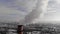 A pipe with white puffs of smoke. Pipes of a city gas boiler house with white smoke against the winter sky. Aerial close