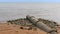 Pipeline industrial waste into sea on sand beach