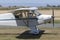 Piper PA-11 Cub Special single engine light aircraft taking off from a country airfield.