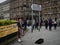 A piper playing bagpipes in Edinburgh`s princes street, Scotland