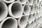 Pipes at the hardware store used for the construction. Close up concrete, cement pipes stacking, pattern background. Asbestos pipe