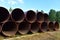 Pipes for natural gas pipeline project. Oil and gas pipelines. Fuel and energy concept. Oil pipeline that would carry tar sands