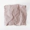 Pipped square piece of crumpled wrinkled craft recycled paper on white background