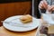 Pipping hot sandwich type breaded food seen in a restaurant.